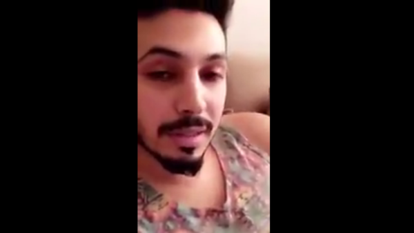 Mamdouh al-Shamri claims the dress he's wearing is from your sister, who left it at his place last night. (Youtube)