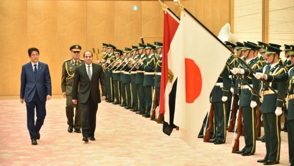 Egypt's President Abdel Fattah al-Sisi and Japan's Prime Minister Shinzo Abe review an honour guard during Sisi's four-day visit to Japan. (AFP/Kazuhiro Nogi)