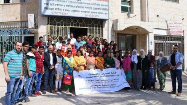 Stakeholders pose for a group photo at the project launch ceremony at the General Trade Union of Workers in Textile, Garment and Clothing Industries. (Jordan Times) 