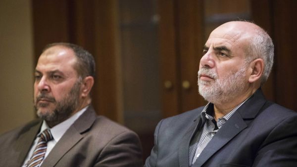Zaki Bani Irsheid (L), former deputy of the Islamic Action Front, and Mohammad Zyoud, party chief of the Islamic Action Front, speaks during a meeting in Amman, Jordan. (Lindsey Leger)