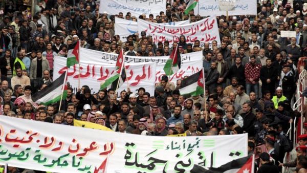 Jordanian Islamic Action Front supporters shouts anti-Government slogans, in Amman, on 18 November 2011, as hundreds of Jordanian protesters mached following Friday noon prayer.