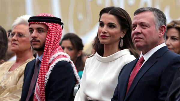 King Abdullah II (R) and Queen Rania (C) of Jordan sit near Crown Prince Hussein (2nd L) and King Abdullah's mother Princess Mona (L) during the ceremony. (AFP)