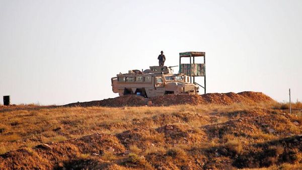 A Jordanian soldier keeps watch at the border between Syria and Jordan on Monday (AFP photo)