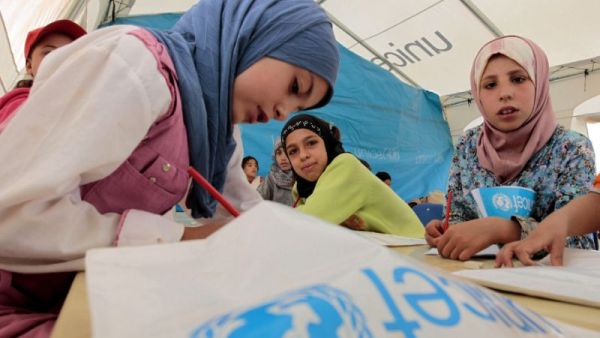 Young Syrian refugees attend a UNICEF-run school at the al-Zaatari refugee camp in the Jordanian city of Mafraq. (AFP/ Khalil Mazraawi)