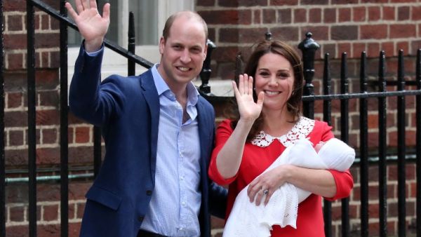 Prince William and Kate Middleton introduce their newborn son outside St. Mary's Hospital in London. The baby's name has been announced as Louis. (Source: ISABEL INFANTES - AFP)