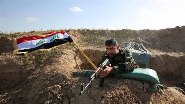A Kurdish fighter holds a position near Kirkuk, Iraq. (AFP/File)