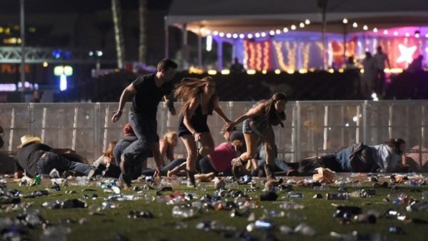 People run from the Route 91 Harvest country music festival after apparent gun fire was heard in Las Vegas (AFP)