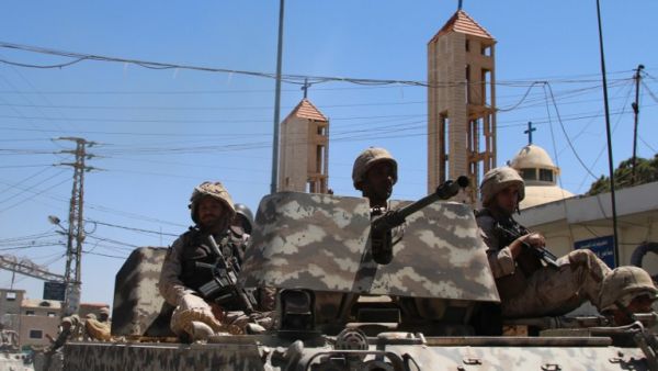 Lebanese soldiers on patrol in al-Qaa, after a series of deadly suicide bombings in the Christian town. (AFP/Stringer)