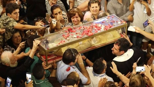 The preserved body of St. Marina was returned from Italy to Lebanon in a glass box. (Daily Star)