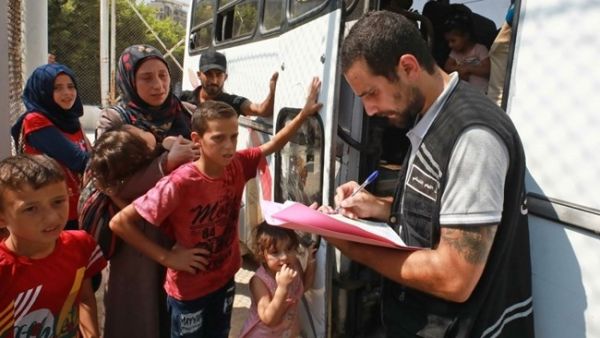 Syrian refugees gather as they prepare to leave Beirut before their journey to return home to Syria on Sept. 4, 2018. (AFP / ANWAR AMRO)