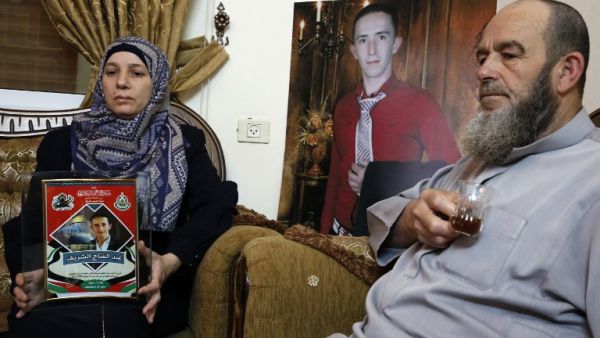 Abdul Fatah al-Sharif and Raja, grandfather and mother of Abdul Fatah who was shot dead by Israeli soldier Elor Azaria while lying wounded on the ground in 2016/ AFP