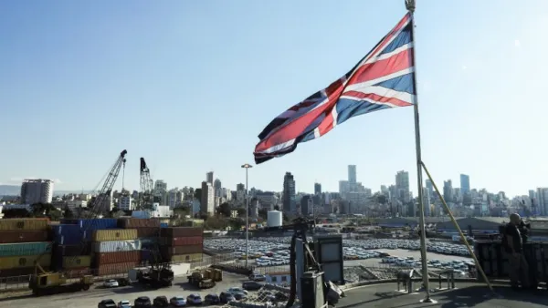 The Union Jack flies from the British Royal Navy's HMS Ocean (L12) amphibious assault ship and helicopter carrier as it lies docked in the port of Beirut. (AFP/Anwar Amro)
