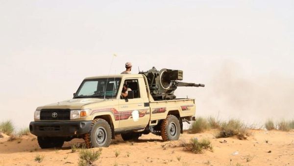 Fighters from the Libya Dawn militia fire at positions of forces loyal to Libya's internationally recognized government. (AFP/ File)