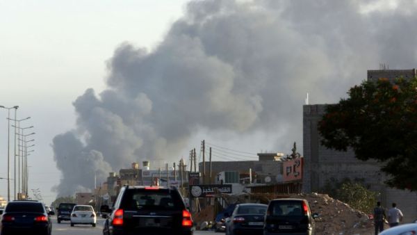 Smoke billows from an area near Tripoli's international airport. (AFP Photo/Mahmud Turkia)