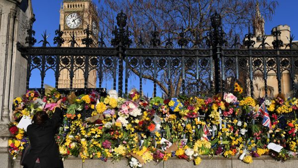 Three people on the bridge died after being hit by the speeding car, then the attacker leapt out and fatally stabbed a police officer just inside the gates of the Houses of Parliament before being shot dead. (AFP)