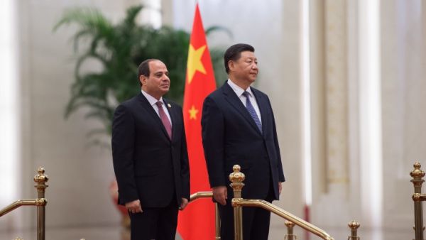 China's President Xi Jinping (R) and his Egyptian counterpart Abdel Fattah al-Sisi listen to anthems during a welcome ceremony at the Great Hall of the People on September 1, 2018. 
Nicolas ASFOURI / AFP