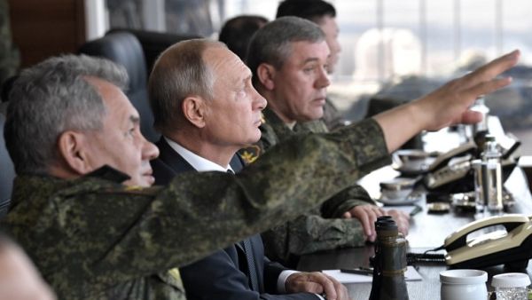 Russia's President Vladimir Putin (C), Defence Minister Sergei Shoigu (L) and Chief of the General Staff of the Russian Armed Forces Valery Gerasimov watch the Vostok-2018 (East-2018) military drills at Tsugol training ground not far from the Chinese and Mongolian border in Siberia, on September 13, 2018. 
Alexey NIKOLSKY / SPUTNIK / AFP