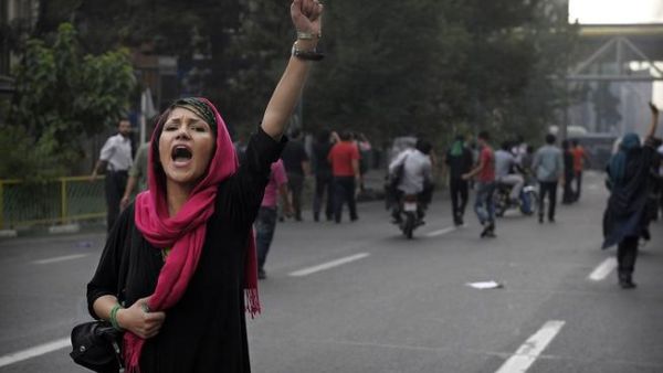 Women protest the mandatory hijab law in Iran. (AFP/File Photo)
