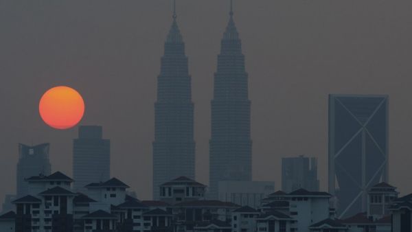 Malaysia's capital, Kuala Lumpur, is growing increasingly unwelcoming to Syrian refugees. (AFP/Mohd Rasfan)