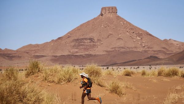 A marathon participant runs through the Sahara desert in Morocco. (AFP/Jean-Philippe Ksiazek)