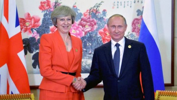 Russian President Vladimir Putin (R) meets with Britain's Prime Minister Theresa May. (AFP)