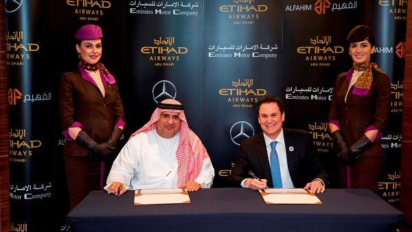 Ahmed Abdul Jaleel Al Fahim, Chairman of Al Fahim Group, and Etihad Airways CEO Peter Baumgartner, signing a three-year agreement.