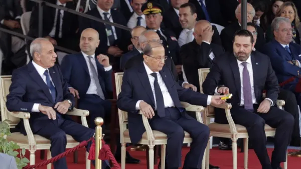 Lebanese Prime Minister Saad Hariri (C-R), President Michel Aoun (C) and House Speaker Nabih Berri (L) attend a military parade to celebrate the 75 th anniversary of Lebanon's independence in downtown Beirut, on November 22, 2018. (ANWAR AMRO / AA / AFP)