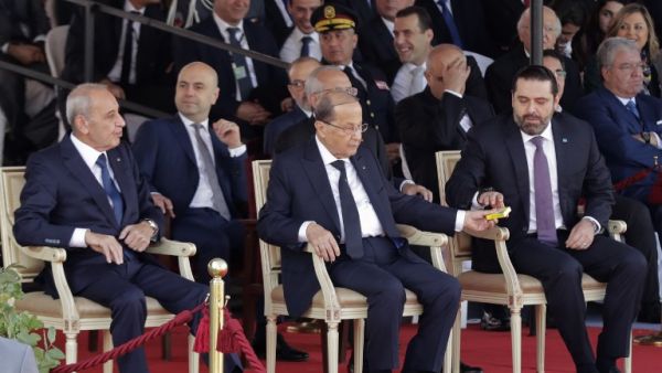 Lebanese Prime Minister Saad Hariri (C-R), President Michel Aoun (C) and House Speaker Nabih Berri (L) attend a military parade to celebrate the 75 th anniversary of Lebanon's independence in downtown Beirut, on November 22, 2018. (ANWAR AMRO / AA / AFP)