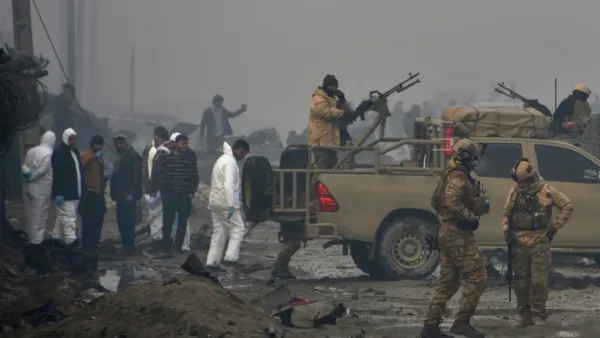 Afghan security forces and investigators gather at the site of a suicide bomb attack outside a British security firm's compound in Kabul, a day after the blast on November 29, 2018. (NOORULLAH SHIRZADA / AFP)