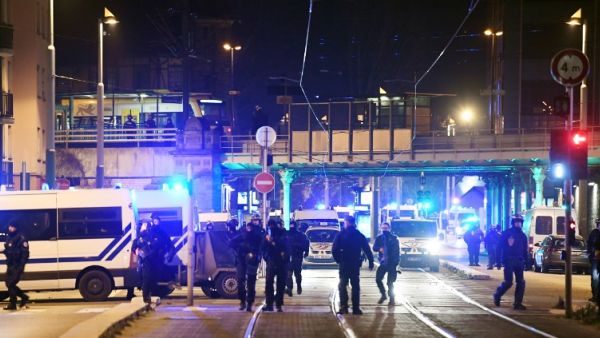 French police officers block the road near the site where Cherif Chekatt, the alleged gunman who had been on the run since allegedly killing three people at Strasbourg's popular Christmas market. (AFP)