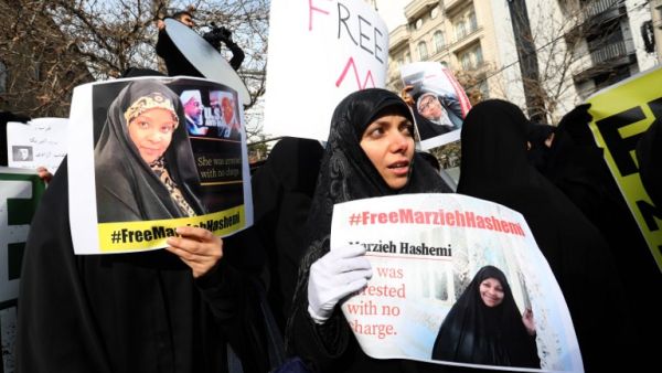 Iranians hold banners bearing messages that call for the release of US-born journalist Marzieh Hashemi, in front of the Swiss embassy in the capital Tehran on January 20, 2019. (AFP/ File)