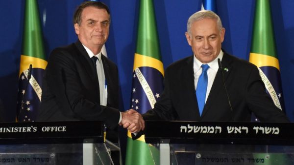 Brazilian President Jair Bolsonaro (L) and Israeli Prime Minister Benjamin Netanyahu shake hands during a joint press conference at the prime minister's residence in Jerusalem on March 31, 2019. (AFP/ File)