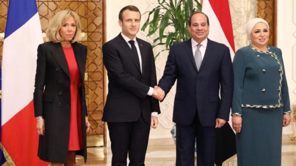 Emmanuel Macron and wife Brigitte Macron are welcomed by Abdel Fattah al- Sissi and Intissar Amer at the presidential palace in Cairo. (AFP/ File Photo)