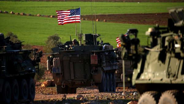A convoy of US forces armored vehicles drives near the village of Yalanli, on the western outskirts of the northern Syrian city of Manbij, on March 5, 2017. (AFP/ file Photo)
