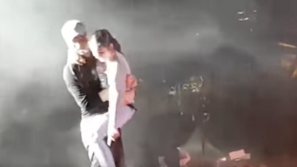 A video on social media alleging that a young girl jumped on stage and leapt into the arms of Spanish singer, Enrique Iglesias. (Screenshot)
