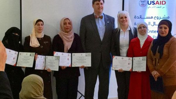 USAID Deputy Mission Director Ralph Koehring (centre) stands with the first group of graduates from Al Nashmeyah Arms for Maintenance Centre on Monday (Photo courtesy of USAID)