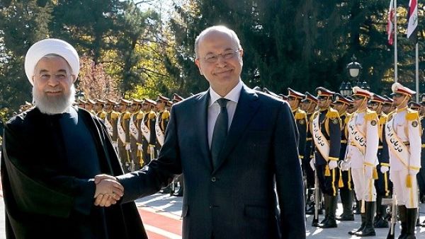 Iranian President Hassan Rouhani shakes hands with his Iraq counterpart Barham Salih in Tehran on Saturday morning. (AFP/ File Photo)