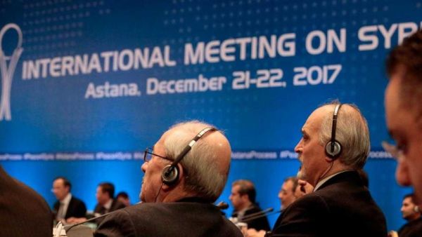 Syrian chief negotiator Bashar al-Jaafari, and other delegates take part in Syria peace talks in Astana on December last year. (AFP)