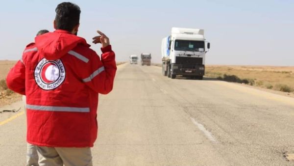 UN and Syrian Arab Red Cross (SARC) aid convoy drives into Rukban camp last November (AFP/File photo)