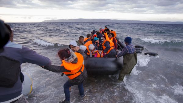 Syrian migrants arrive from Turkey on boat through sea with cold water near Molyvos, Lesbos on an overload dinghy. (Shutterstock/ File Photo)