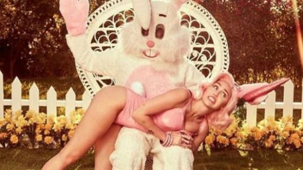 Back at it: Miley Cyrus followed Saturday's sexy photo session by unveiling three risque videos that came from the same shoot (Source: Miley Cyrus - Instagram)