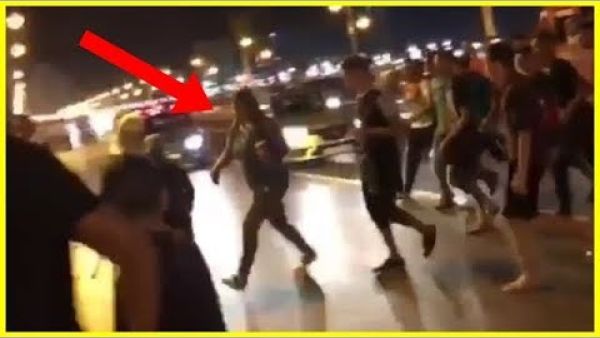 The video, lasting just 10 seconds, shows a clearly panicking woman in jeans and a t-shirt being chased by a large group of young men | Youtube.
