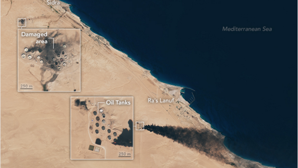 Satellite imagery shows the damaged oil fields near Libya's coastline, where fierce fires have produced thick black smoke intense enough to be seen from space. (NASA)