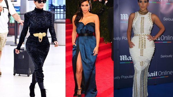 كيم كارداشيان وقد زيينت خصرها بحزام ذهبي عريض