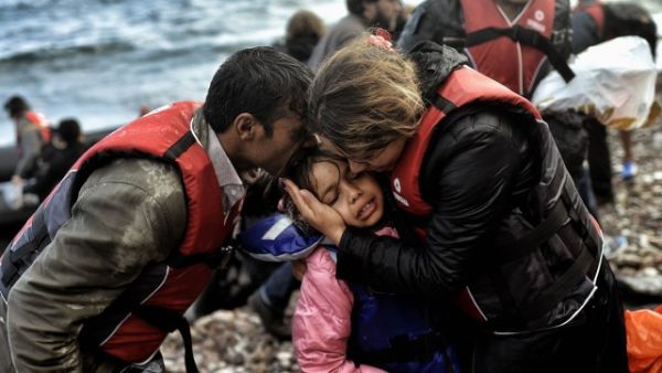Syrian family becomes emotional after surviving the treacherous crossing between Turkey and Greece. (AFP/File)