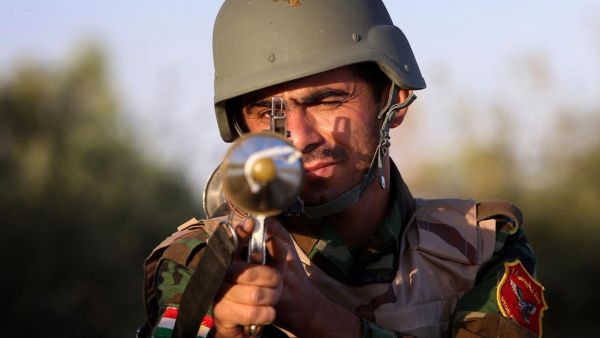 A Kurdish Peshmerga fighter poses with his weapon on the front line in Makhmur, Iraq. The Peshmerga are fighting to protect Kurdistan. (AFP/File)