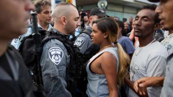 Ethiopian Israeli protestors scuffle with Israeli police during a demonstration against police brutality and racism. (AFP/File)
