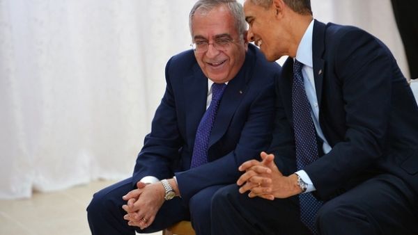 UN Secretary-General Antonio Guterres informed the Security Council that he intends to appoint former Palestinian prime minister Salam Fayyad, seen here beside former US president Obama, to replace Martin Kobler of Germany, who has been Libya envoy since November 2015. (AFP/File)