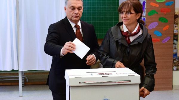 Viktor Orban and wife Aniko Levai at a polling station in Budapest on October 2, 2016. (AFP/Attila Kisbenedek)