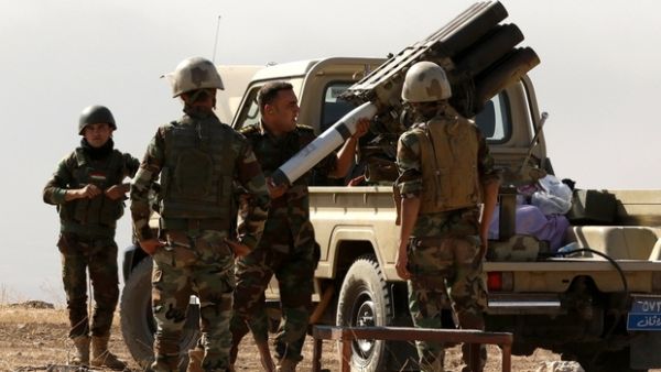 Iraqi forces load artillery outside Mosul. (AFP/File)
